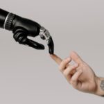 robot and human fingertips touch